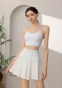 Detail of white scalloped hem athletic skort and high waist design for tennis and yoga