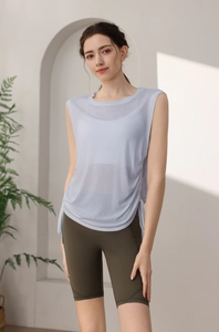 Detail of light blue yoga tank top with side drawstring design and lightweight fabric
