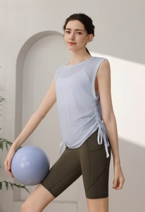 Detail view of light blue tencel yoga tank top with side drawstring ruching for fitness