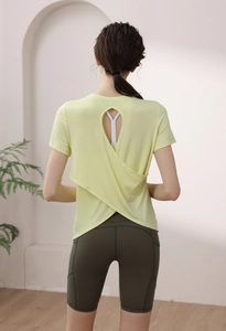 Detail view of the back crossover design and teardrop cutout on this modal yoga top