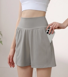 High-waisted gray yoga shorts featuring a side pocket designed for large smartphone storage