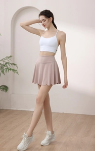 Detail of high-waisted petal edge yoga skirt with built-in liner for tennis and fitness