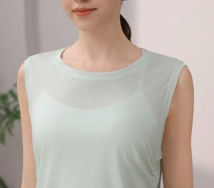 Detail of light green quick-dry yoga tank top with double-layer crew neck for women