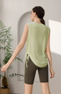 Rear view of thin yoga tank top with side drawstring and high-waist cycling shorts