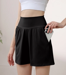 Detail view of high waist yoga shorts with a functional side pocket for a smartphone