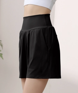 Side view of high-waisted black yoga shorts featuring hidden side pocket and slimming fit