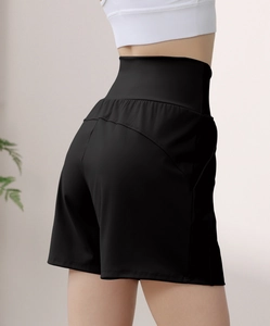 Detail view of high waist tummy control black yoga shorts with ergonomic seam design
