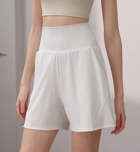 Detail view of high-waisted white sports shorts featuring lightweight quick-dry fabric