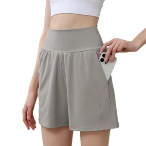 Women high waisted gray yoga shorts with side pockets for phone storage and tummy control