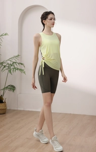 Close-up of yellow drawstring sports vest and olive green high-waist cycling shorts