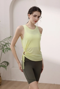 Detail of light yellow yoga tank top with side drawstring ruched texture for women