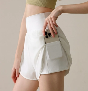 Detail of high-waist sports shorts featuring a side pocket for secure phone storage