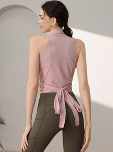 Haut de yoga ajusté pour femme avec nœud au dos et leggings verts avec poches latérales