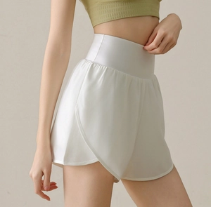 Detail of high-waisted white sports shorts with a double-layer anti-exposure design