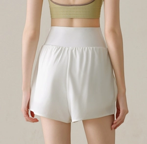 Rear view of white high-waisted quick-dry athletic shorts with wide waistband design