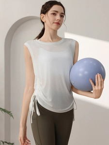 Relaxed fit white yoga vest with side drawstrings and breathable mesh fabric for women