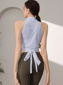 Débardeur de yoga bleu clair ajusté avec dos croisé pour la course et le pilates