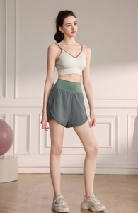 Detailed view of high-waist double-layer athletic shorts and sports bra for yoga