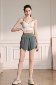 Women high waisted workout shorts with layered design and V-neck sports bra set