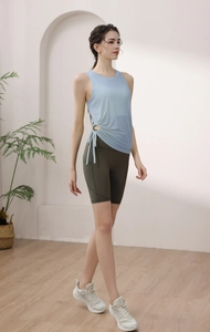 Detail of light blue yoga tank top with side drawstring and adjustable cinch waist design
