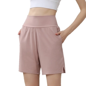 Women's high waisted loose nylon athletic shorts with pockets in dusty rose color