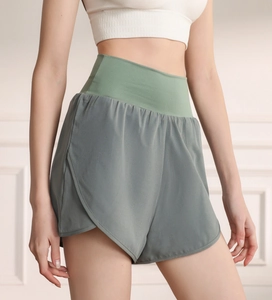Close-up of high-waisted fitness shorts with side slits and breathable quick-dry fabric