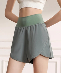 Detail view of high-waist sports shorts featuring quick-dry fabric and petal-cut hems