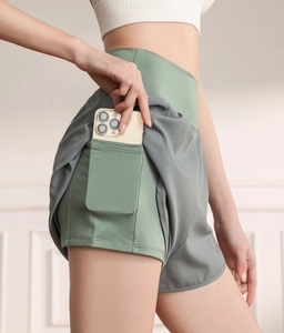 Detail shot of high-waist sports shorts showing the inner lining with a hidden phone pocket