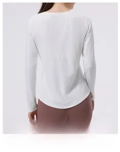 Close-up of four-needle six-thread reinforced stitching on white women's yoga top