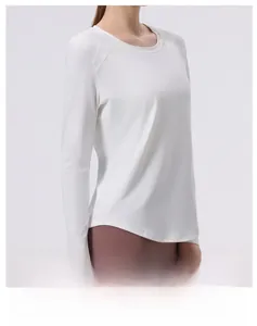 Close-up of white long sleeve yoga top featuring seamless four-needle six-thread stitching