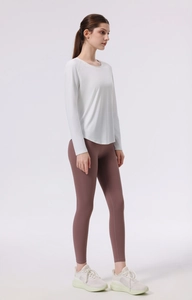 Detail of four-needle six-thread stitching on long sleeve yoga top and leggings