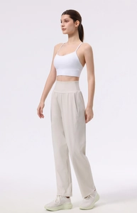Detail of high-waisted wide-leg yoga pants with premium nude-feel fabric texture