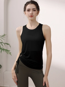 Women yoga fitness set with black drawstring tank top and dark green leggings