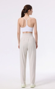 Rear view of high waisted wide leg yoga pants in beige with a seamless nude-feel design