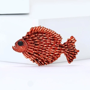 Cute enamel fish brooch in copper finish with textured scales and black gemstone eye