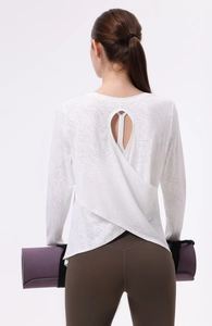 Top da yoga jacquard bianco con apertura sulla schiena e orlo incrociato elegante