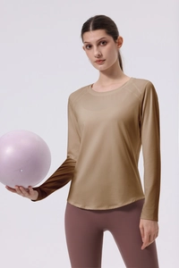 Detail of slim fit long sleeve yoga top with durable flatlock stitching for women