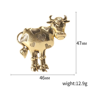 Vintage golden alloy cow brooch with heart texture and rhinestones, size 46mm by 47mm