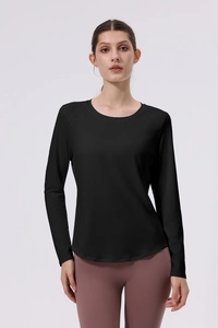 Detail of black long sleeve yoga top featuring four-needle six-thread stitching and slim fit