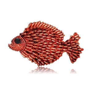 Detailed red fish brooch with textured metal finish and black gem eye on white base