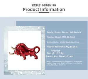 Macro detail of red enamel bull brooch with gold horns and polished alloy finish