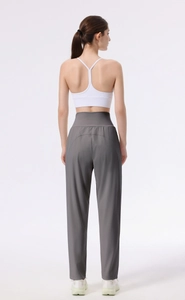 Detail showing the U-shaped back seam and high-waisted cut of dark grey yoga pants