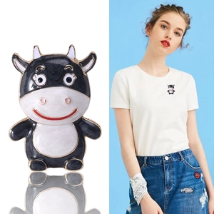 Creative cartoon cow enamel brooch in black and white finish for fashion accessory