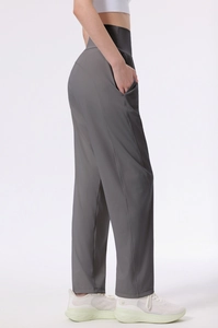 Detailed side view of high-waisted dark grey sports pants with functional side pockets