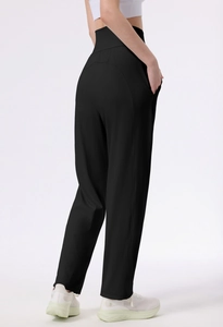 Detailed side view of high-waisted black yoga pants with functional side pockets