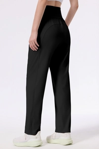 Detail view of high waisted black yoga pants with professional athletic matte fabric