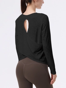 Top sportivo nero a maniche lunghe con motivo jacquard e design a schiena scoperta