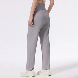 Women's high waist yoga pants in grey featuring a slimming straight leg athletic fit