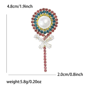 Detailed view of rhinestone lollipop brooch with measurements 4.8cm height and 2.0cm width