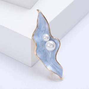 Elegant light blue enamel leaf brooch featuring two white pearls and golden metallic trim
